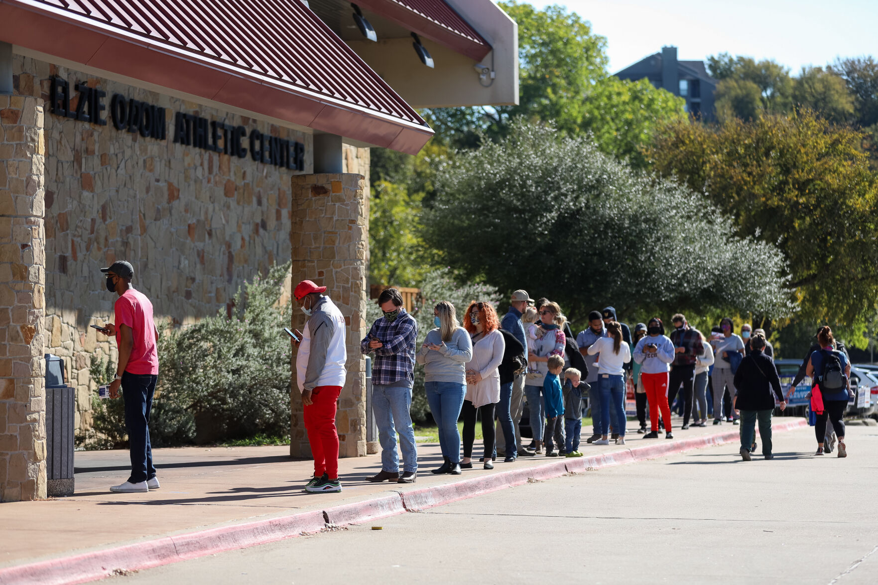 Photos: Metroplex voters brave cold weather at the polls, businesses board windows on Election Day
